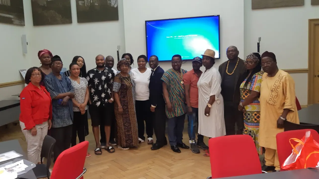 Foundation volunteers and staff posing together with an AFSF banner at an outdoor event site.